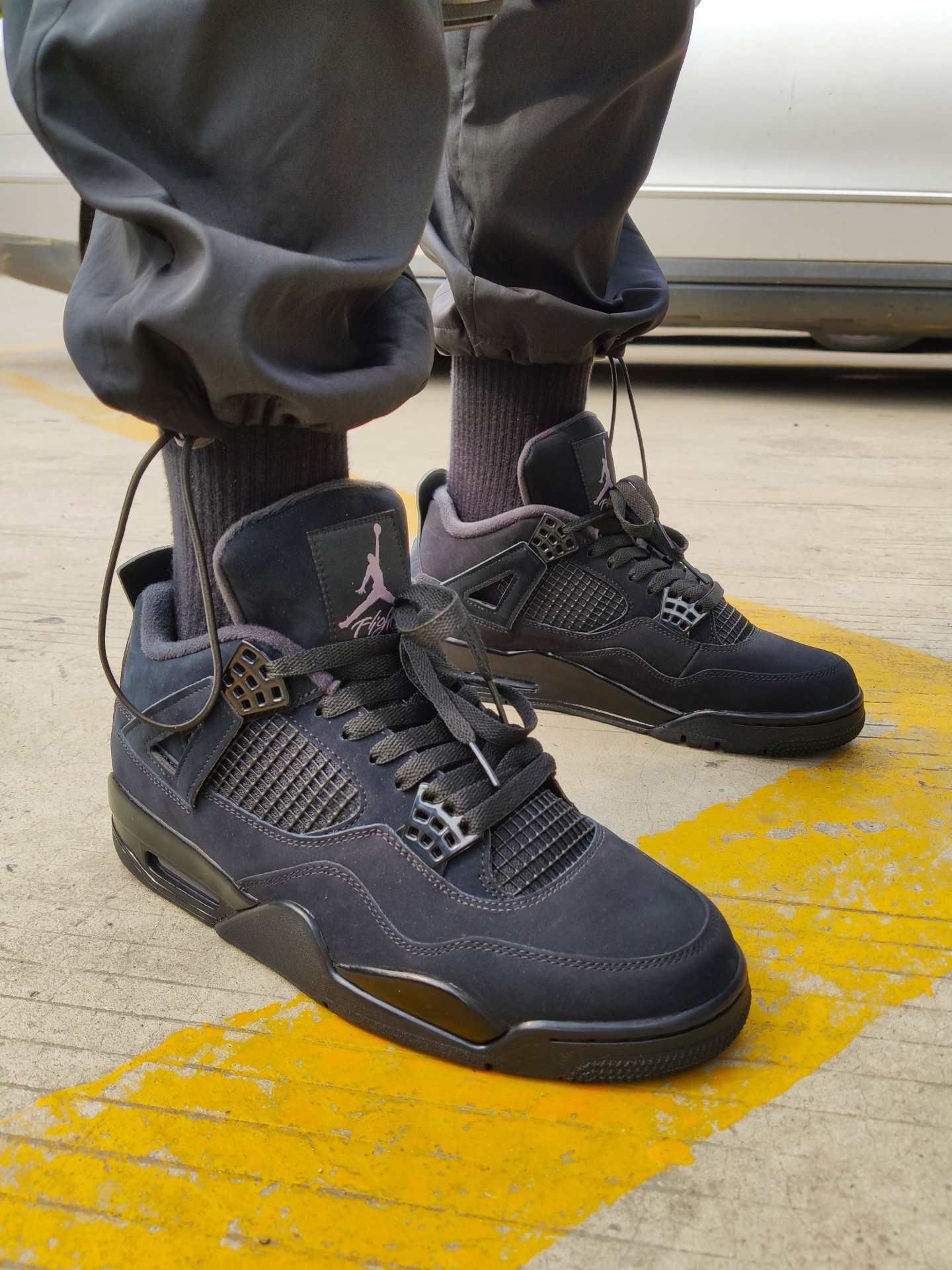 black cat 4s on feet