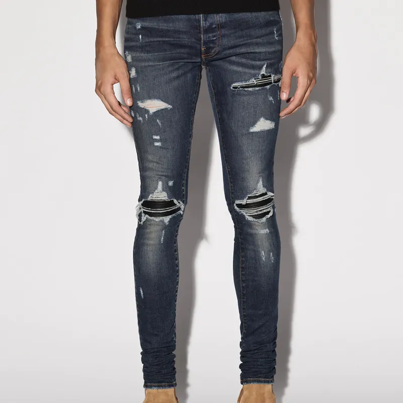 AMIRI Logo Distressed Skinny Jeans-1