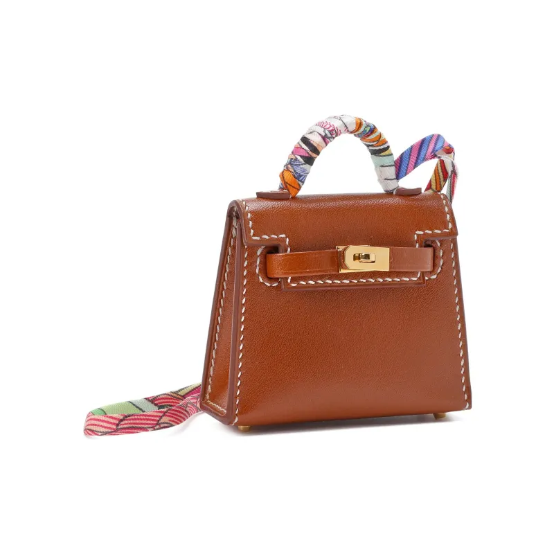 HERMES Kelly Twilly Tadelakt Bullock Leather Pendant Bag Accessory Unisex Gold Brown-1