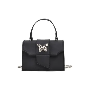 Meow in the grass Handbags