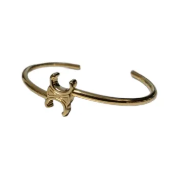 CELINE Triomphe Asymmetric Cuff In Brass With Gold Finish