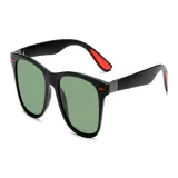 Black Frame with Green Lens and Red Accent