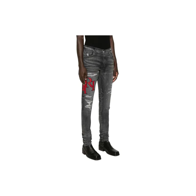 AMIRI Staggered Logo Distressed Skinny Jeans-3