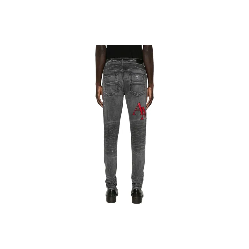 AMIRI Staggered Logo Distressed Skinny Jeans-2