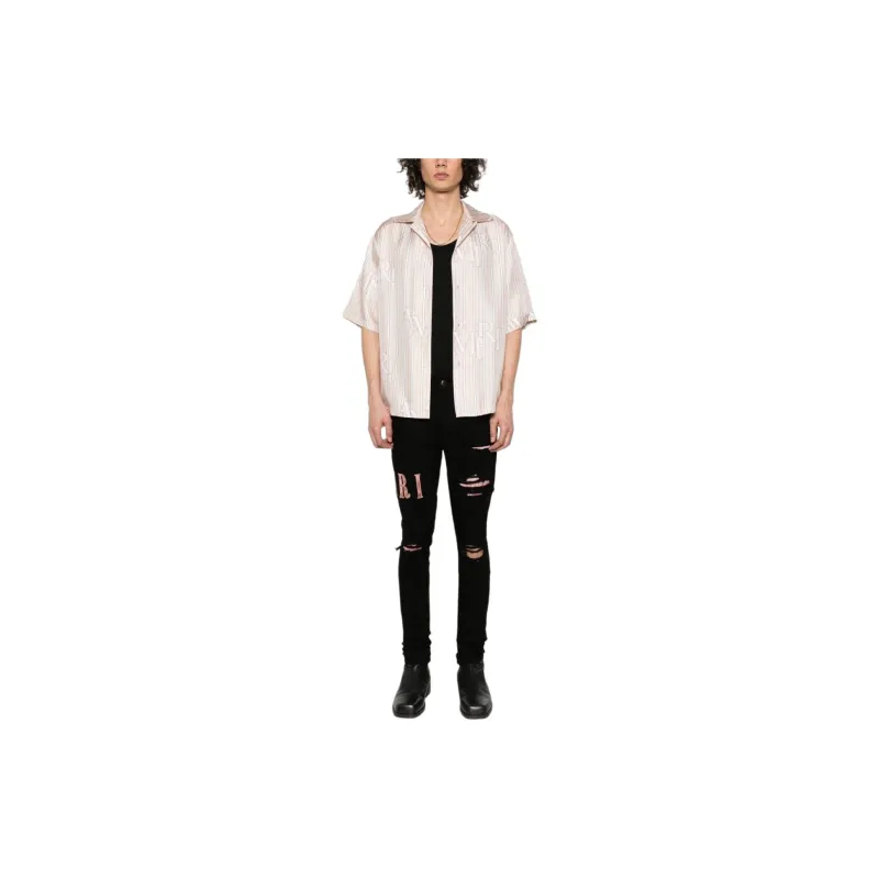 AMIRI Waxed Logo appliqué Skinny Jeans-1