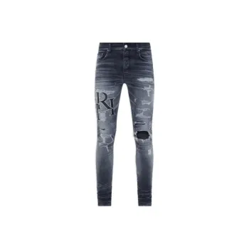AMIRI Logo print Ripped Skinny Jeans