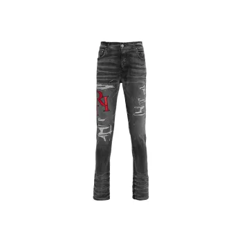 AMIRI Staggered Logo Distressed Skinny Jeans