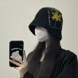 Alexander McQueen logo-embroidered bucket hat