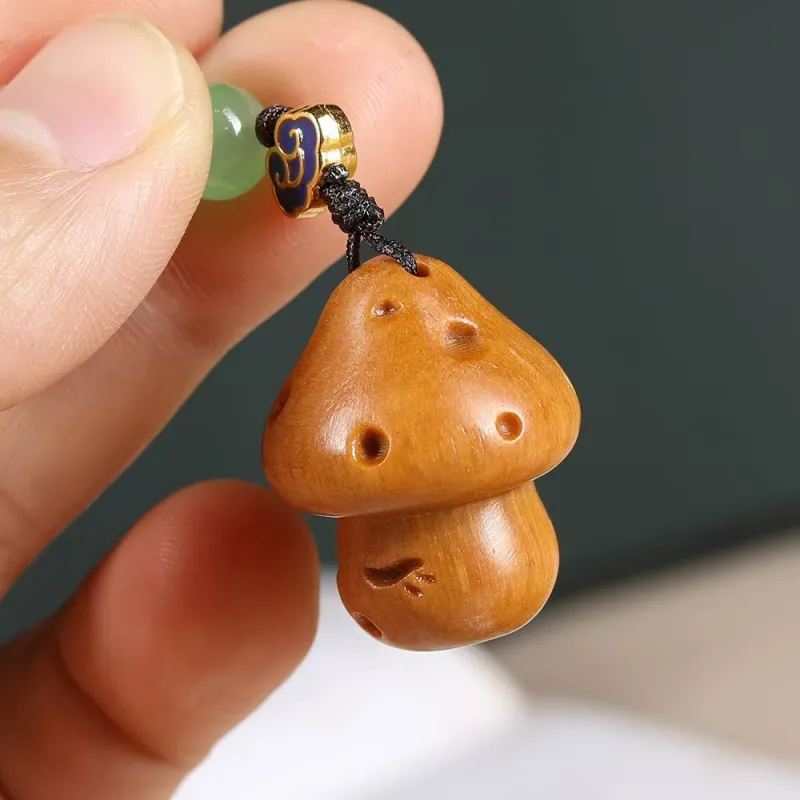 Is Here Sandalwood Cell Phone Pendant Unisex-4