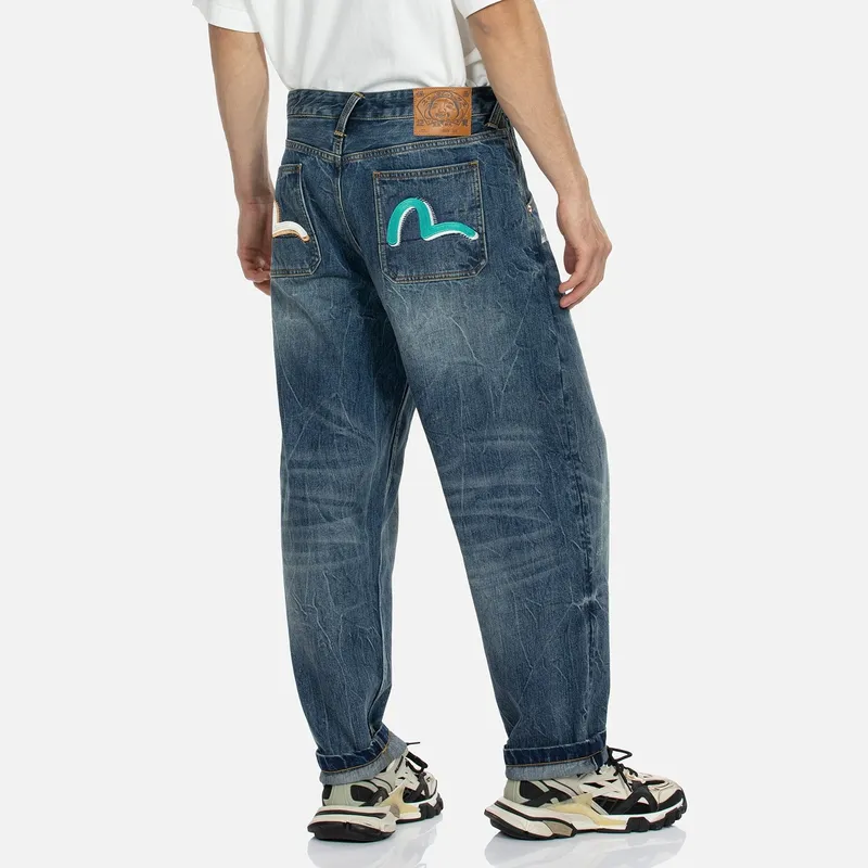 EVISU Slogan-print Tapered-leg Jeans-2