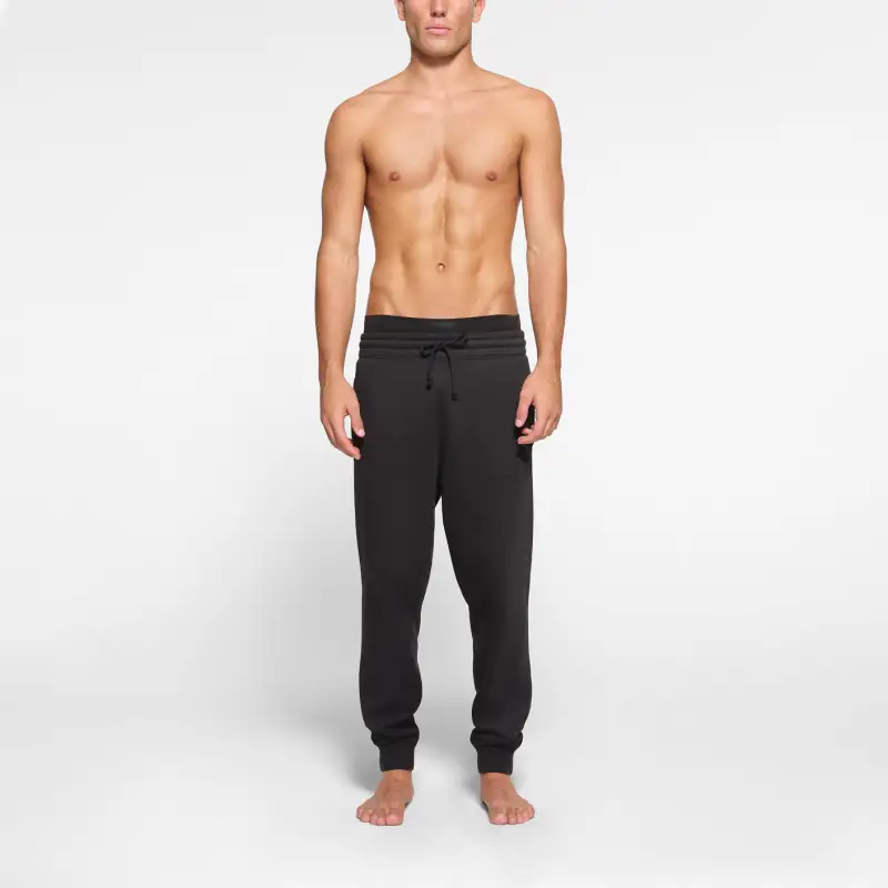 SKIMS FLEECE LOUNGE MENS TAPERED JOGGER Casual Pants Men's WASHED ONYX/Waterwashing Manau-1