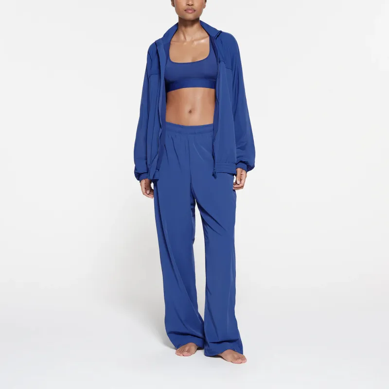 SKIMS TRACK WOVEN NYLON OVERSIZED JACKET Jackets Coats Women's COBALT/Cobalt Blue-1