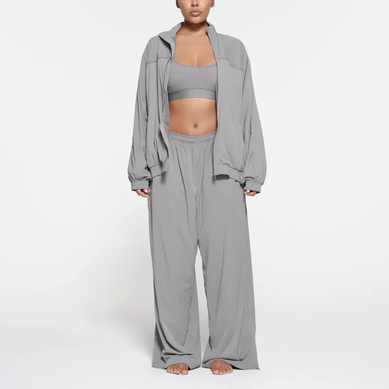 SKIMS TRACK Collection TRACK WOVEN NYLON OVERSIZED JACKET Jackets Coats Women's PACIFIC/Pacific Color-1