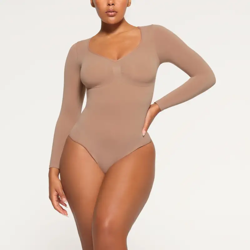 Skims SEAMLESS SCULPT LONG SLEEVE THONG BODYSUIT Bodysuits Women's SIENNA/Ochre-1